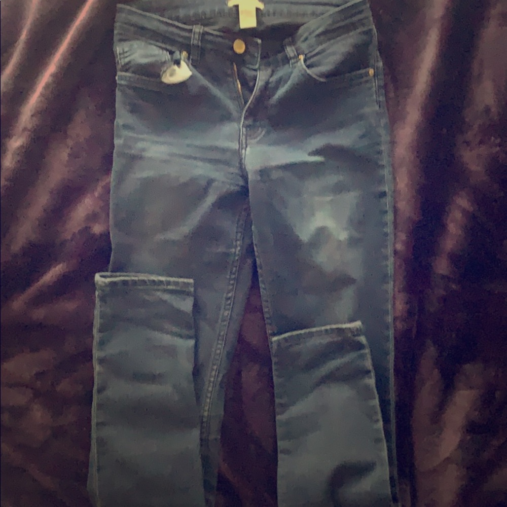 A dark wash denim skinny jean.